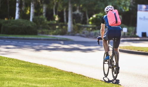 This image: an illustrative photo of a cyclist.
						The map: on the satellite mapping we have shown an existing public right of way footpath to remain
						and a existing public right of way to be diverted within the site boundary,
						a proposed public right of way diversion and proposed permissive paths, the
						Birmingham Fazeley Canal towpath, Peddimore on-road pedestrian/cycle routes,
						Peddimore permissive paths, stopped up Blind Pit Lane and stopped up Blind Pit Lane
						(access maintained for non-motorised users). The map also has pop-up information
						markers which highlight propsoed sustainable travel initiatives. Existing
						and extended bus routes have also been shown